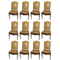 A set of 12 Jansen Dining Chairs in the Regence Manner