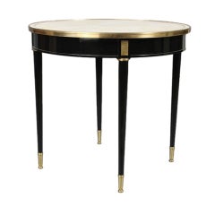 A Fine  Pair of Louis XVI-Style Ebonized and Gilt Bronze Tables