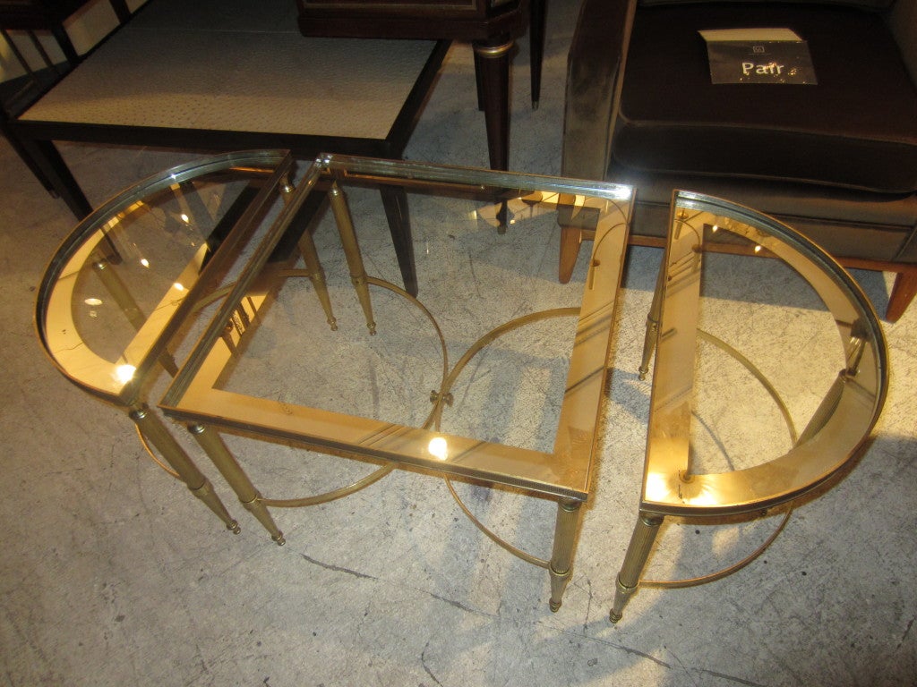 Exquisite three part brass cocktail or coffee table.