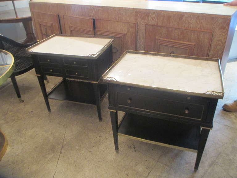 A Pair of Ebonized Two -Tiered, Marble-top Nightstands with Brass Gallery on Fluted Legs Ending in Brass Sabots. These can also be sold separately.