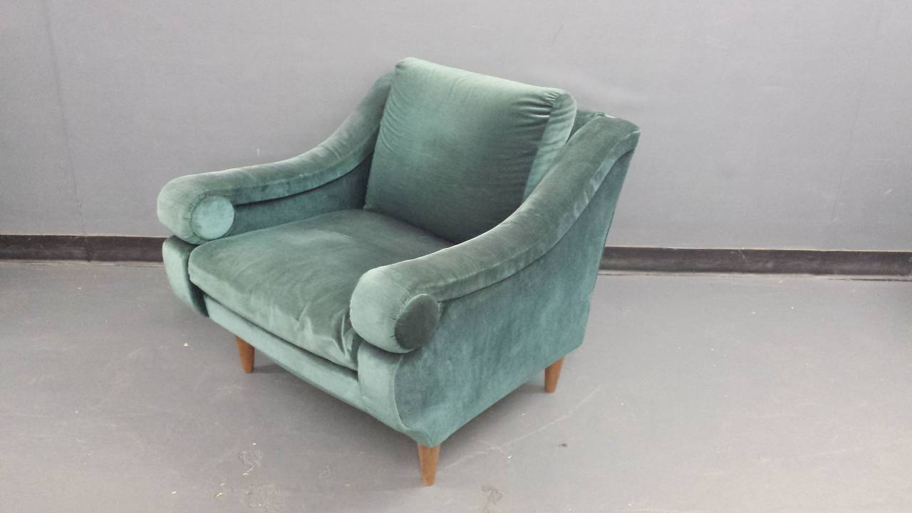 A whimsical and unusual pair of French upholstered club chairs, in original fabric, very comfortable.