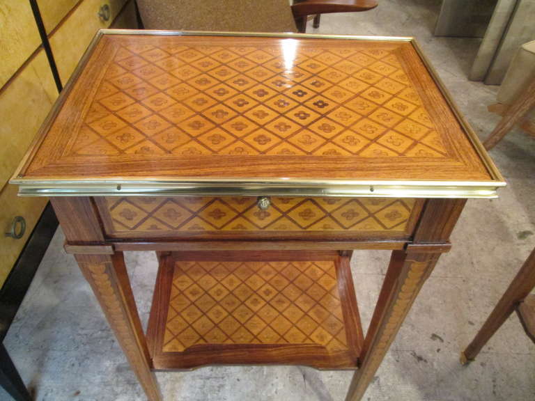 An exquisite pair of parquetry tables, with bottom shelf, pullout extension and one drawer.
French, late 19th century.