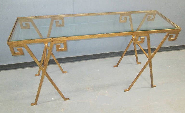 Gilt glass top console with Greek key pattern motif.