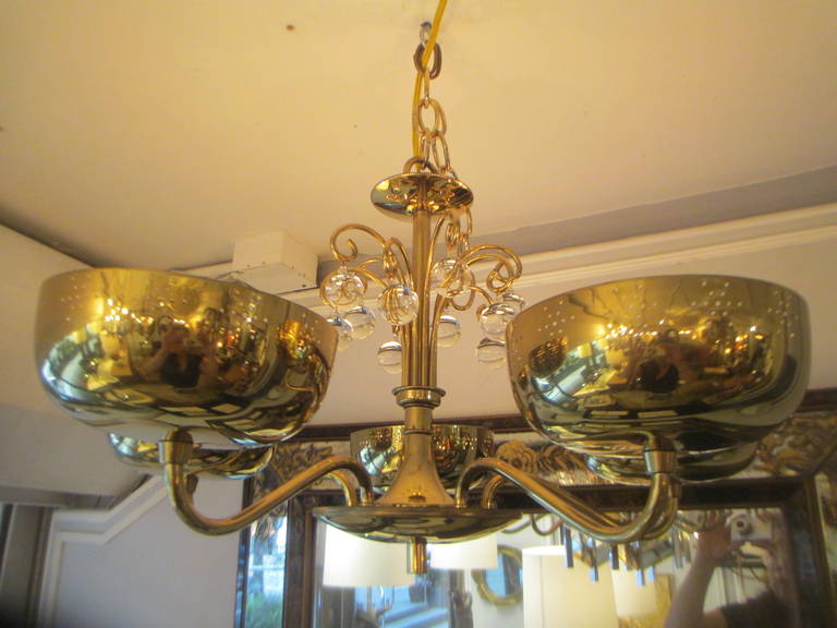 Five-arm brass fixture in the manner of Paavo Tynell.

Price reduced / net price $5,500.