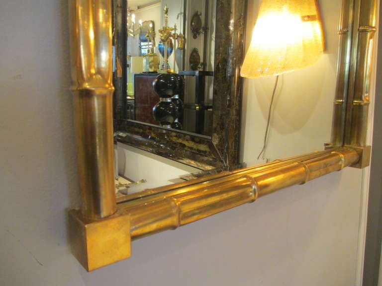An exceptional pair of faux-bamboo brass mirrors 1