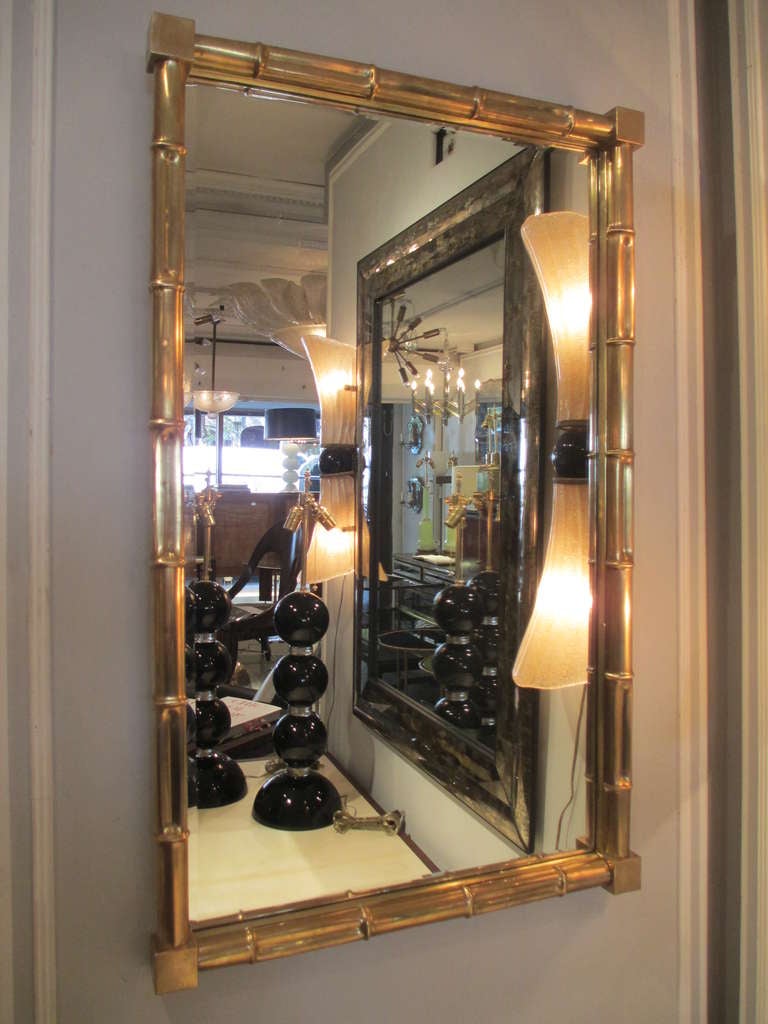 French An exceptional pair of faux-bamboo brass mirrors