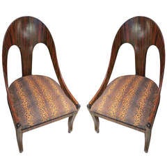 A pair of faux-rosewood spoonback chairs