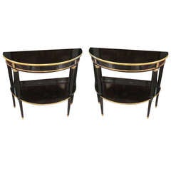 A Pair Of Bronze And Brass Mounted Ebonized Demilune Consoles