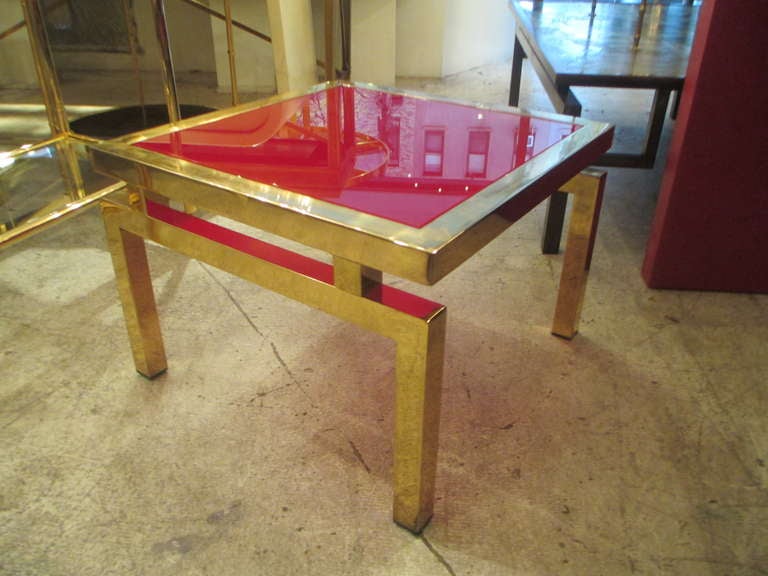 French Pair of Mid-Century Modern Brass Tables with Red Glass Tops