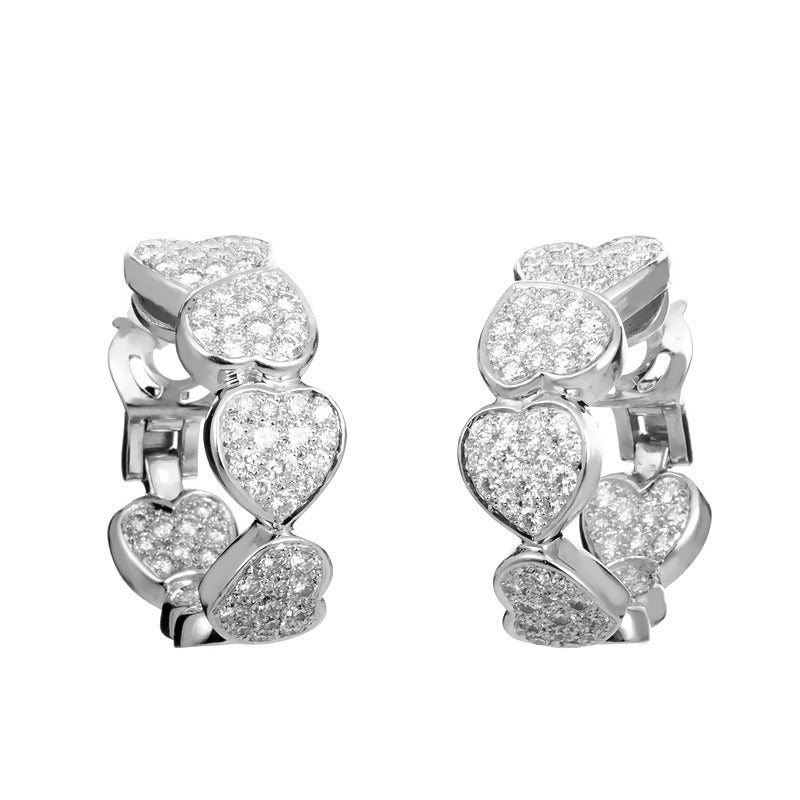 This pair of hoop earrings from Fred of Paris are ravishing and unique. These hoop earrings are made of 18K white gold and boast heart shaped motifs set with ~3.81 ct of diamonds
Retail Price: $29,700.00
