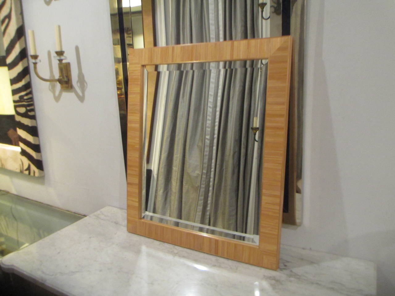 Custom straw parquetry mirror, this mirror can be custom made in any size
turnaround time is 6 to 8 weeks

The origins of straw marquetry have their roots in Asia where straw has many uses in everyday life. Rice straw was used to make mats and