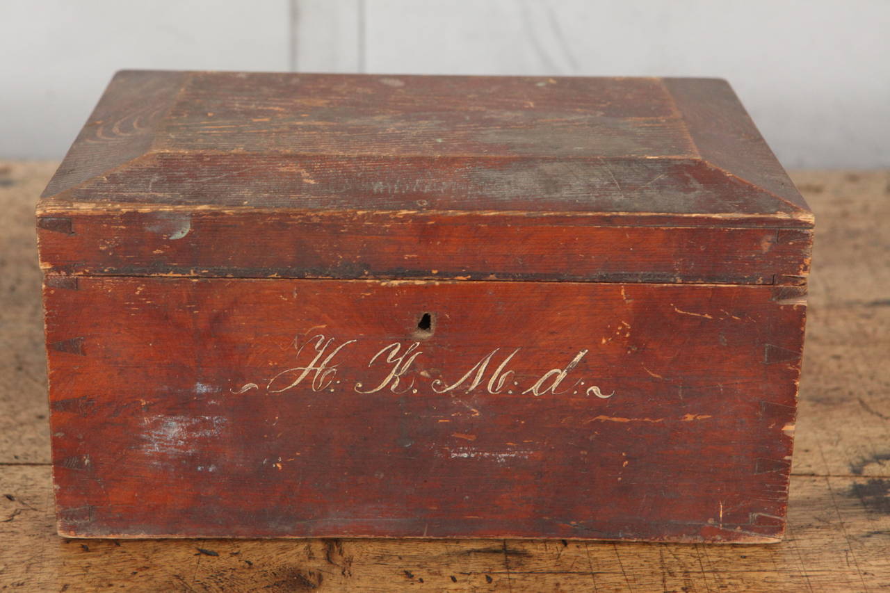 This Box has beautiful rustic surfaces and signs of use that indicate it's age as well as wonderful examples of superb craftsmanship. The box has nice dovetail corners, good English lock and hinges and a nicely beveled lid. The hand painted letters