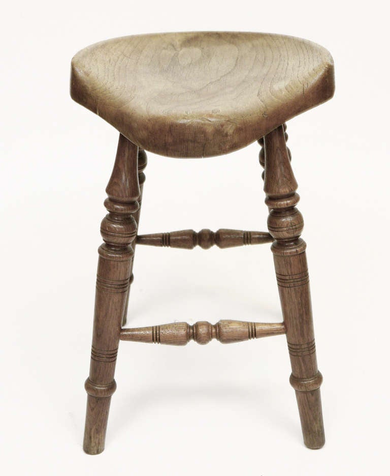 A good stool having a shaped carved seat and fully turned legs and stretchers. This stool will look good and work in a period or other setting.