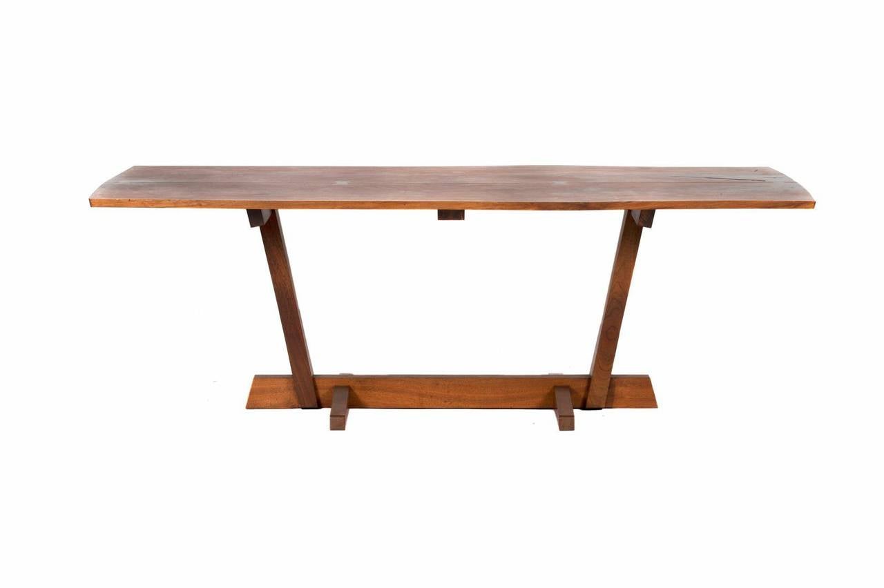George Nakashima Conoid dining table, New Hope, PA, 1976; 
Walnut; Signed with client name; 29