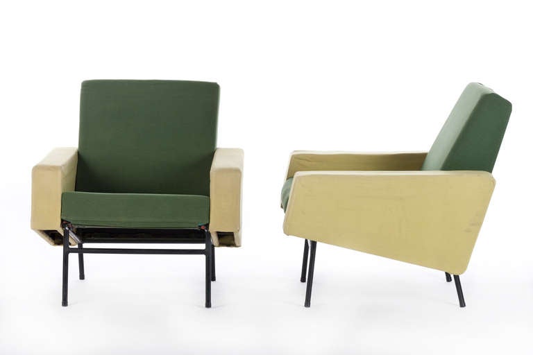 Pierre Guariche lounge chairs, pair, by Airborne, Italy, angular forms upholstered in the original two-tone green fabric, trapezoidal armrest panels to sides, black rod bases, original finish to frames, one signed with Airborne label