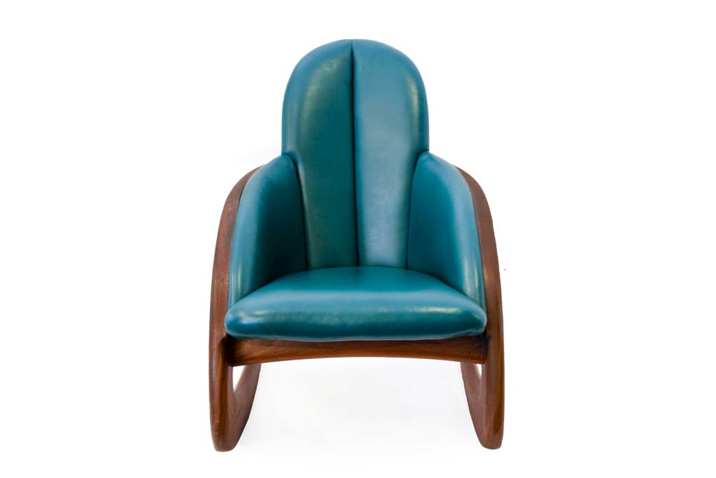 Cresent Rocker by Wendell Castle with walnut base and leather upholstery.