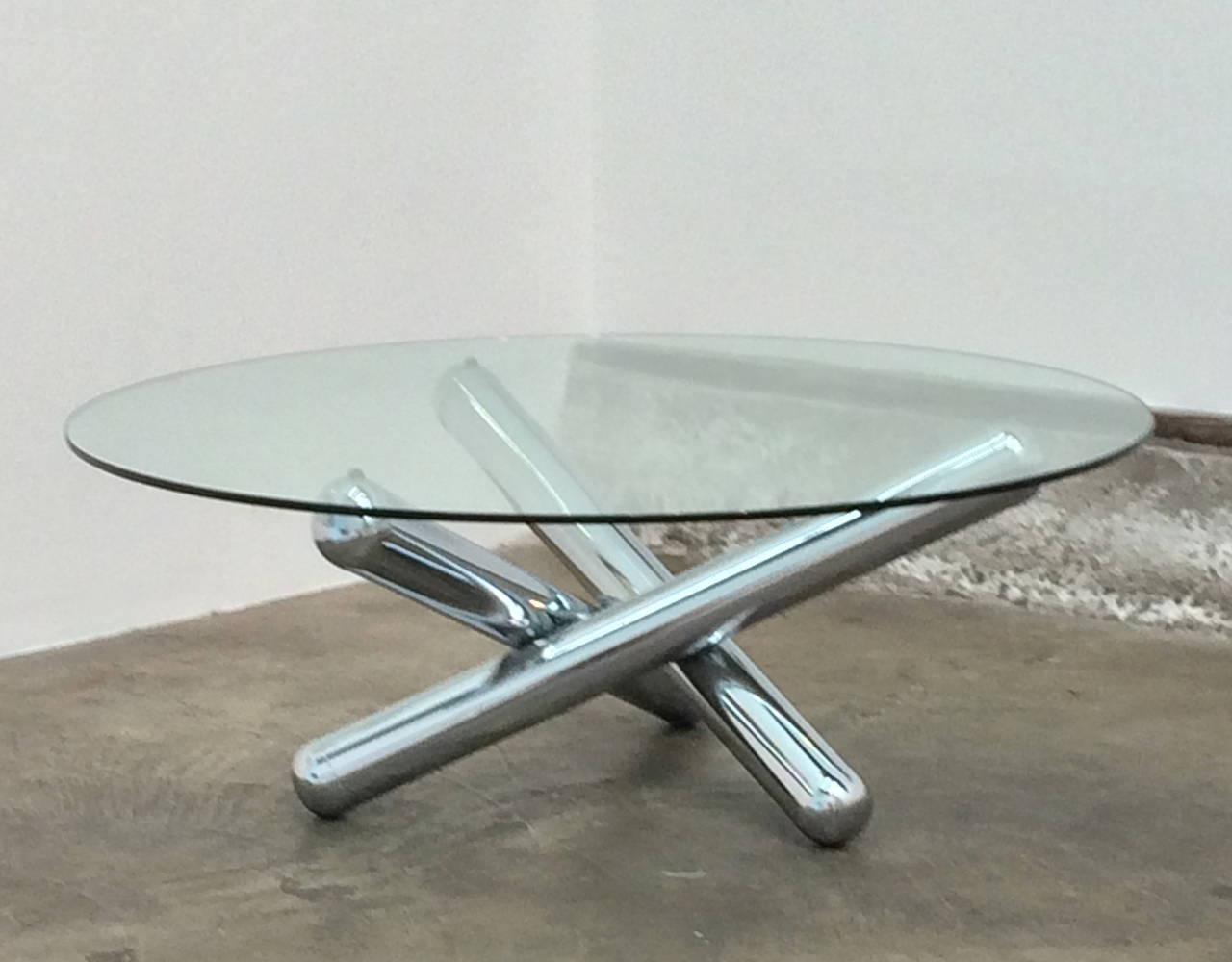 Jax table,
1970s.
Polished, welded chrome base, rubber bumpers, glass top
42 inches in diameter.
15 inches high.
3/8 inch glass.
Excellent condition.
