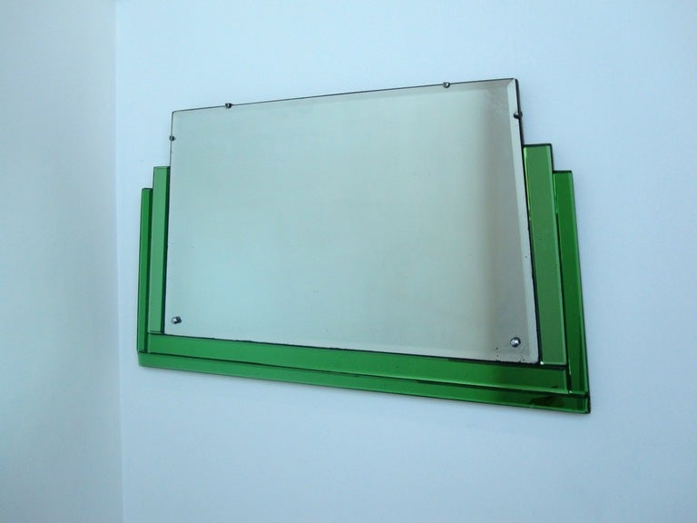 Art Deco Mirror with green glass trim
circa 1930
Everything original, wooden back, metal hanging chain
