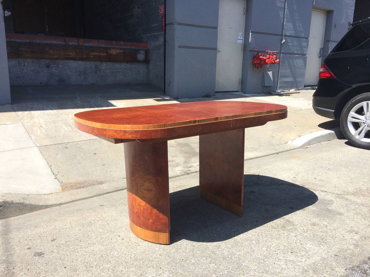 Art Deco Dining Table in the Style of Marcel Guillemard
circa 1930
burl wood veneer
approx 60 x 36 x 26 inches high (plus leaf which nestles inside table)
Very good condition
