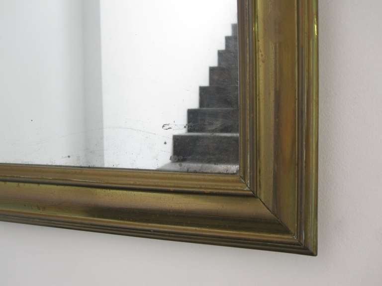 Brass Frame with Vintage Mirror
Probably French
19th Century
34 x 26 inches
What appears to be original glass and wood backing