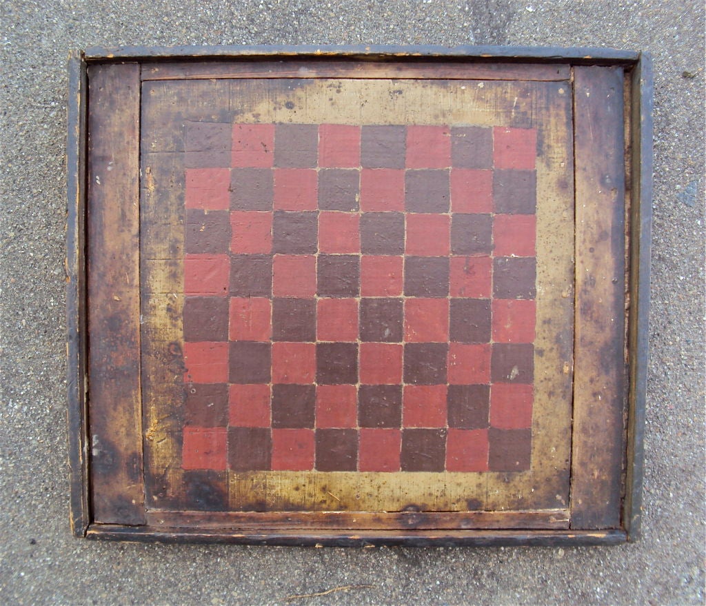 Red and Brown checkerboard with an unpainted wood border. Assembled from 5 pieces of wood plus the frame. Found in Lowell, Massachusettes. Acquired from Timothy and Pam Hill, American Antiques, 1979.