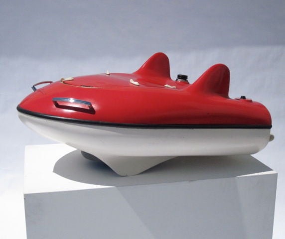 Museum quality design. Extreme rarity. The ultimate plaything or adornment for one's yacht. Beautiful, sexy race car lines on this personal nautical craft which predates the Jet ski. The pilot rides by hanging onto the back rails. Craft does not