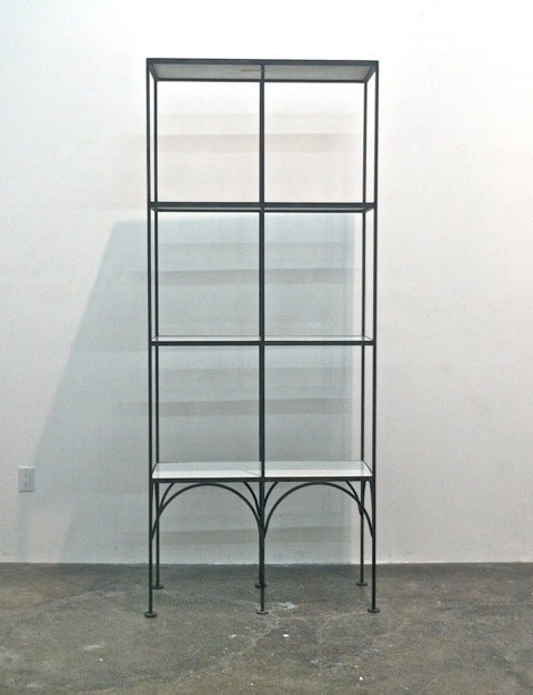 Late Modernist Etagere with coliseum arches at the base.
Circa 1960
Wrought Iron welded frame construction, milk glass shelves.
Excellent condition.