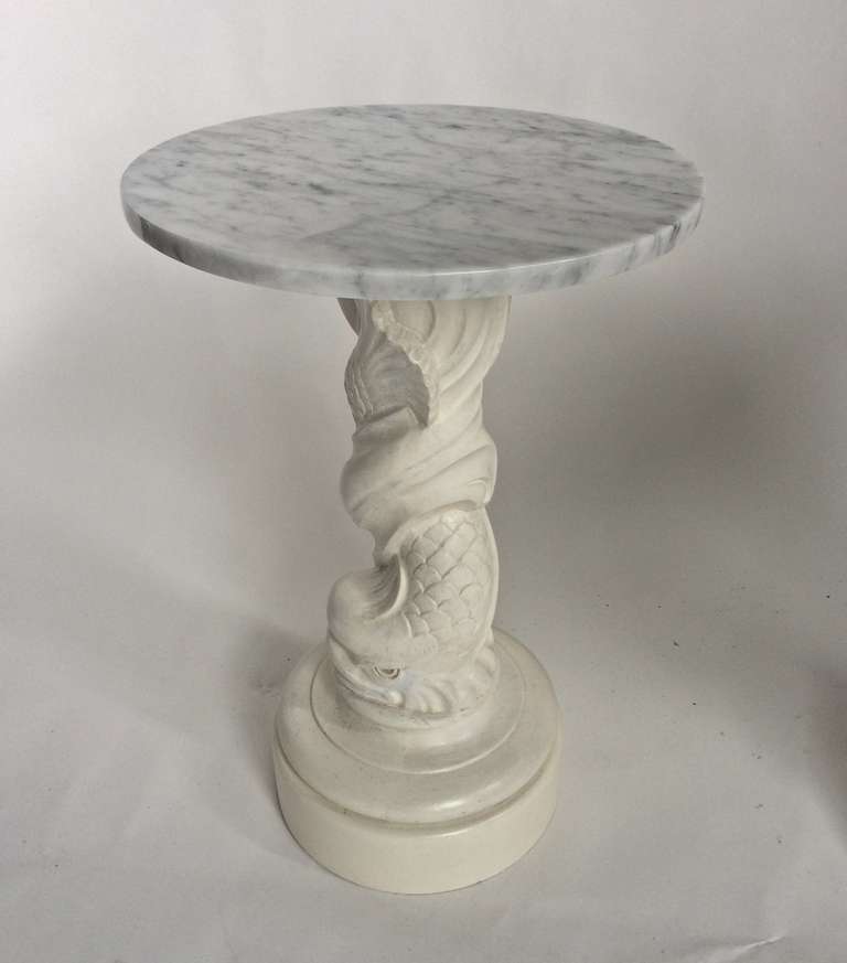 Dolphin Tables, circa 1950, cast plaster, wood, paint, carerra marble. 21 inches high, 18 diameter