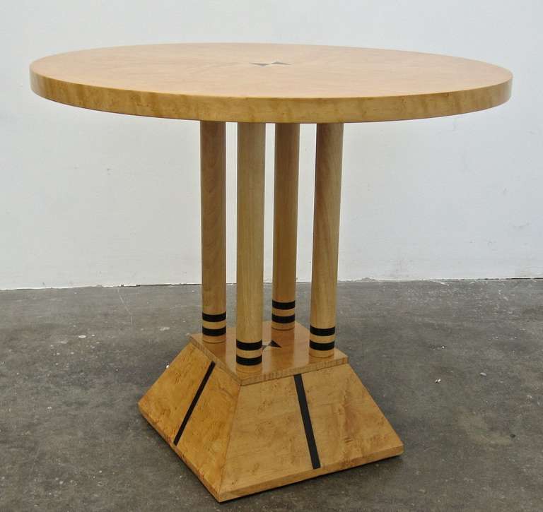 Post-modern Neoclassical Table in the style of Michael Graves.  Circa 1980.  Manufactured by Masterly, Italy.  Birds eye maple veneer with ebony wood inlays.  21 inches high x 23.25 inches in diameter.  Excellent original condition