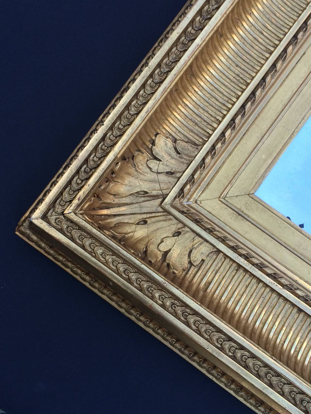 Second Empire Frame with Mirror
1850-1870
France
Carved, gessoed, gilded and beveled wood, antique glass
17.5 x 15.75 x 2.5 inches
Illegible stamp en verso with Framemaker's name and address in Paris
Good condition, chips and minor losses