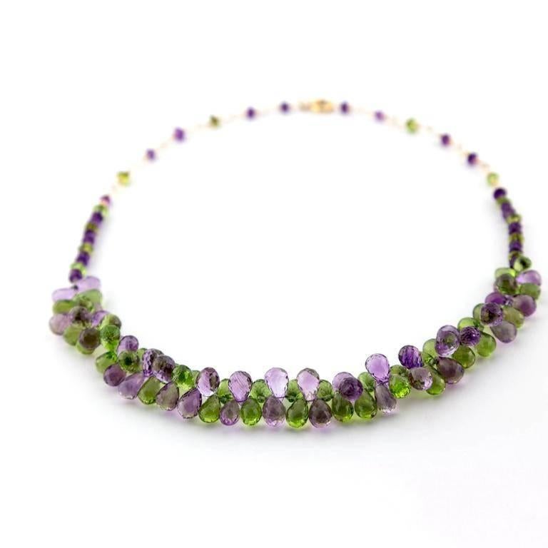 This piece is very dazzling! Its three dimensional movement allows it to sparkle, catching all angles of light. It dances around your neck with beautiful shades of purple and green and has a comfortable delicate texture. It's fun, it's playful, it's