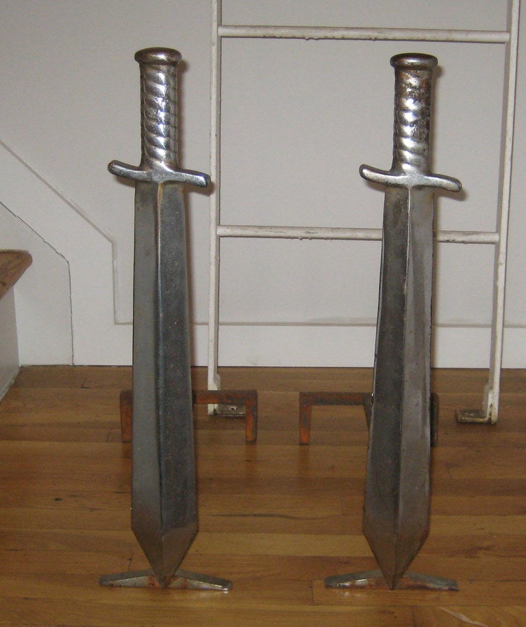 Whimsical chromed iron sword-form andirons.