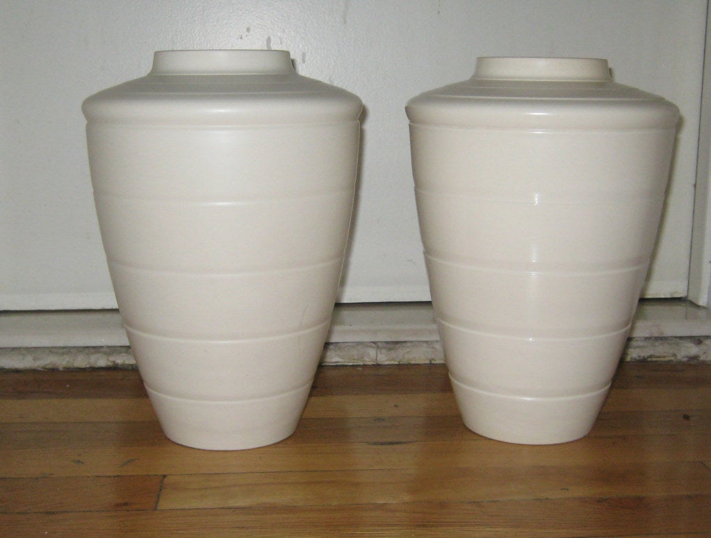 Rare pair of matching white bisque porcelain vases by British Art Deco master Keith Murry.  Murry's hand-signature stamp was used for only the first year he was employed by Wedgewood in 1932.  By 1933 it replaced with the more familiar KM ensignia.
