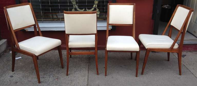 Side chairs with split sides and curved headrest.
