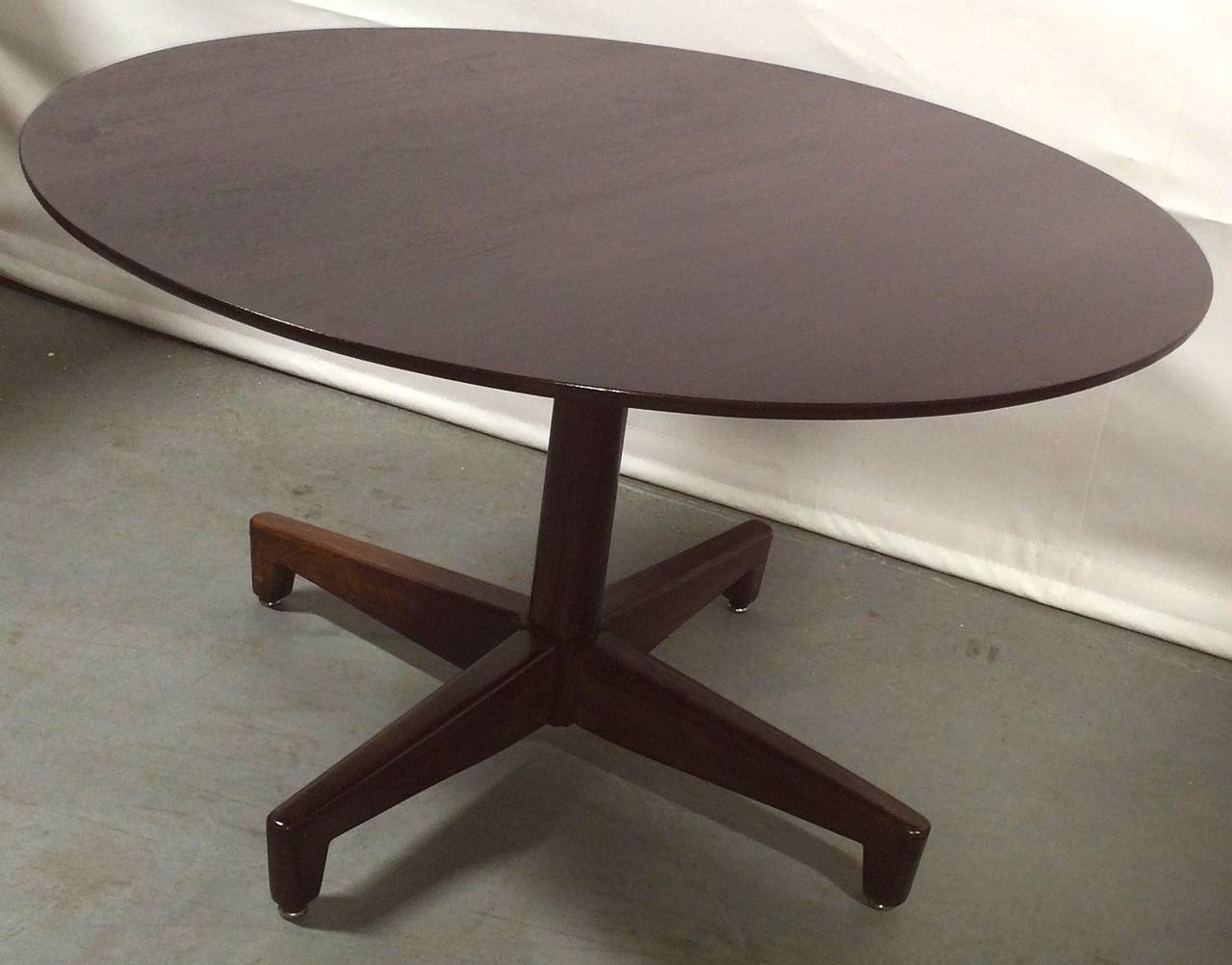 Pedestal coffee table on articulated base. Custom designed for the Herbert and Rita Leroy commission, circa 1950.