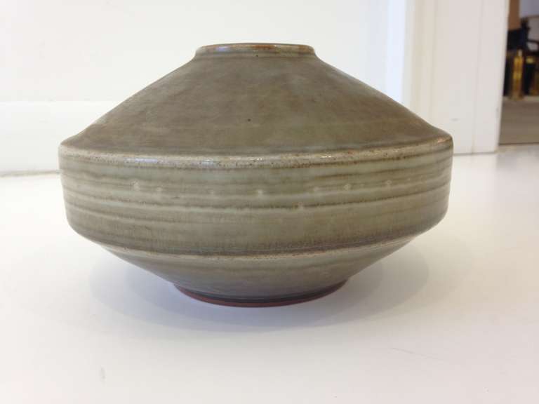 Fantastic modernist saucer shape vase in matte grey glaze. Hand-thrown one of a kind vase by master potter Carl Harry Stalhane, head designer for Rorstrand pottery. Signed and dated on underside.