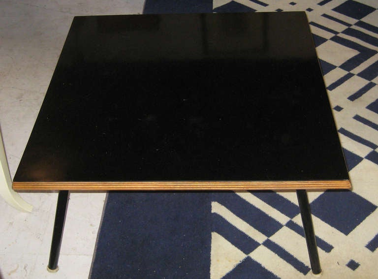 Low coffee table with black laminate top and decorative bevel highlighting stacked plywood construction.  For Steph Simons.