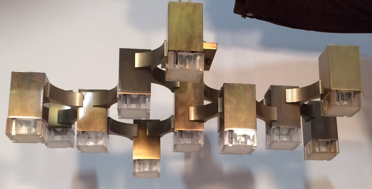 Chic 13 ight chandelier in beautifully patinated bronze with incised cube Perspex shades.  Can also be mounted as large wall sconce.