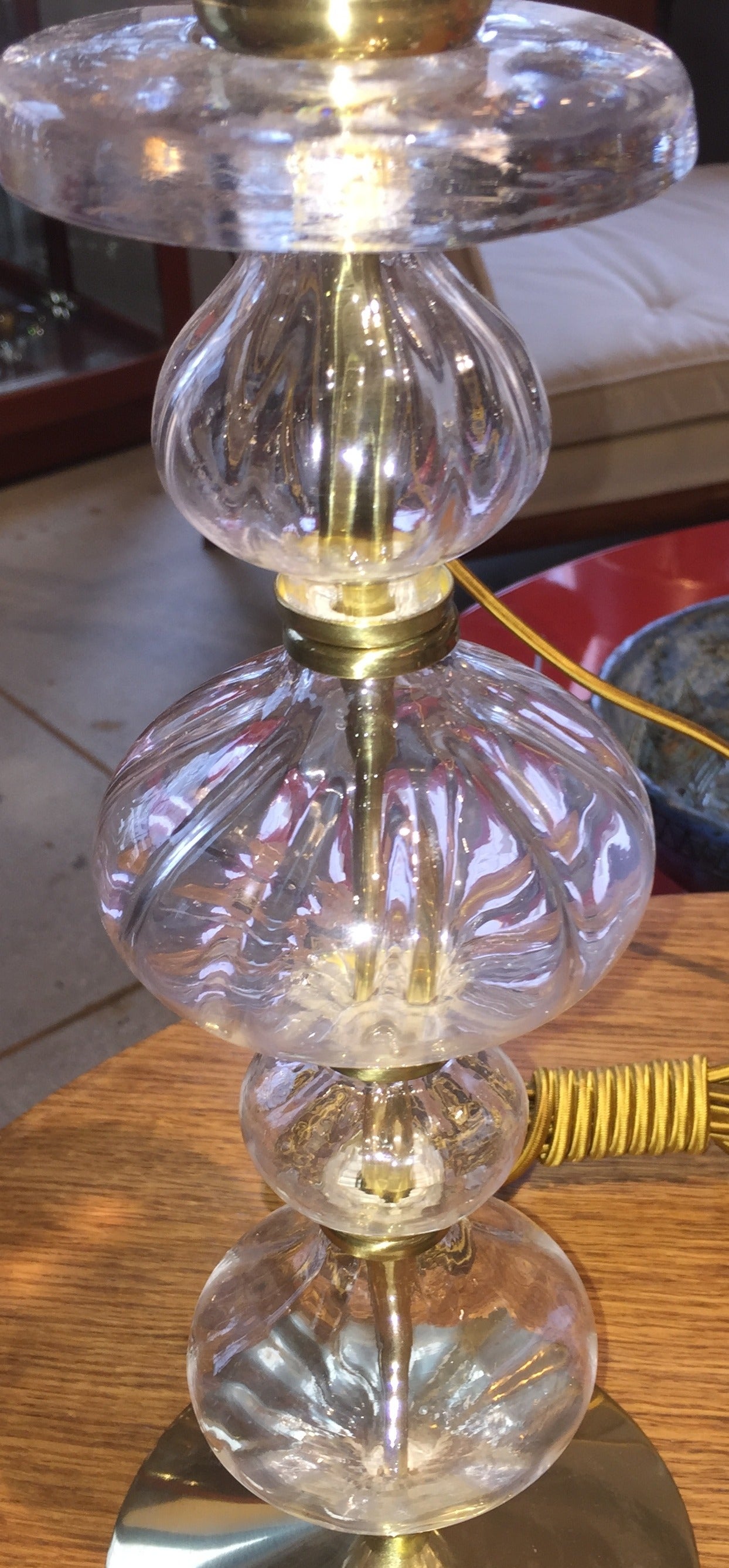 Handblown glass with gold-plated base and hardware. Wired at the socket in the European style. Signed to base.