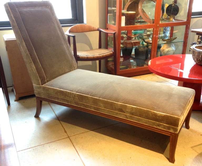 Great and rare transition piece in European walnut with Kravet olive silk velvet upholstery.  Fluted sabre legs and sharp tailoring are an early example of the neo-classical designs Gibbings immortalized in his work of Saridis of Greece.

Baker