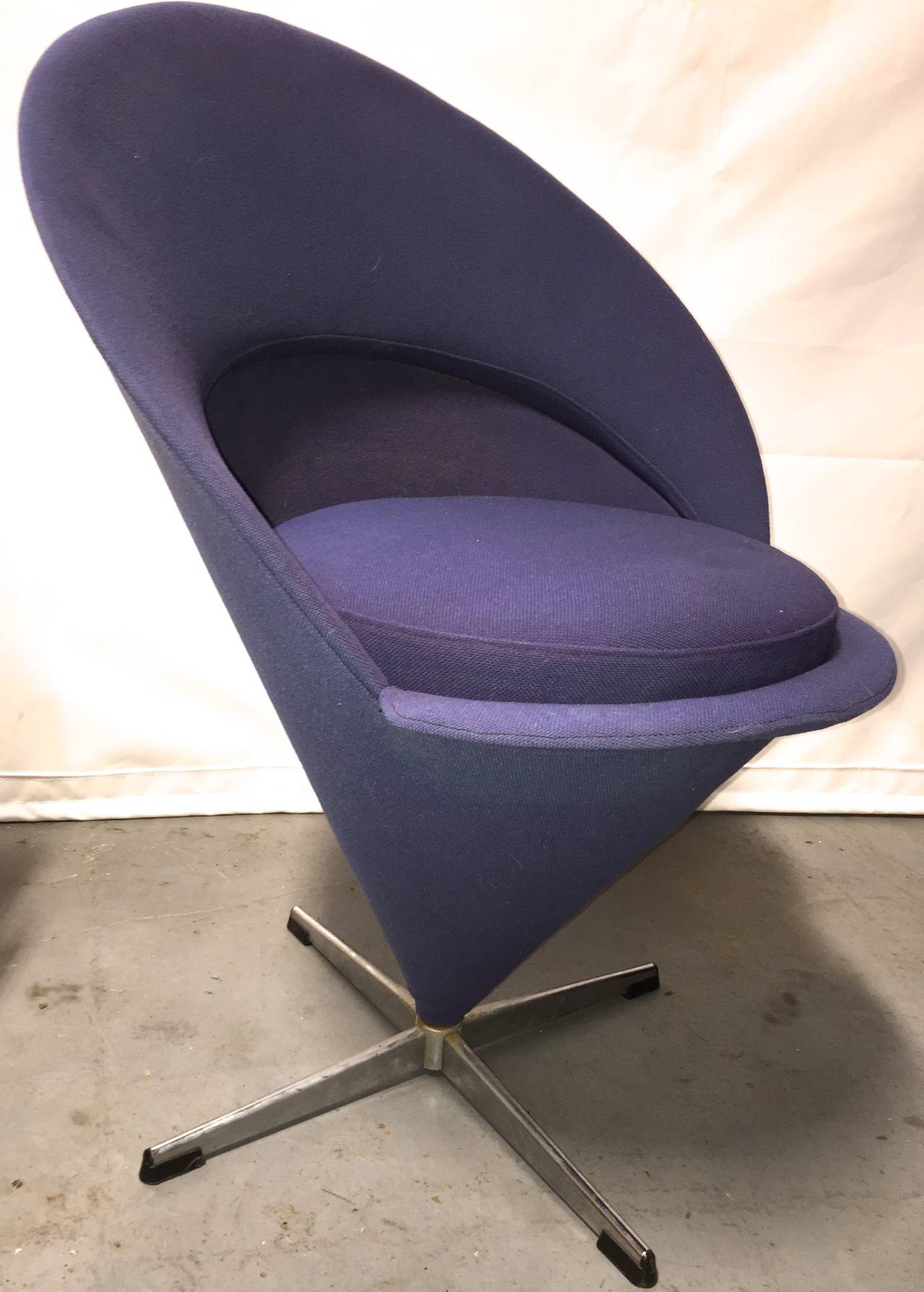 Nice early pair of Panton's pop Classic. Original upholstery, one in navy one in purple for Fritz Hansen.