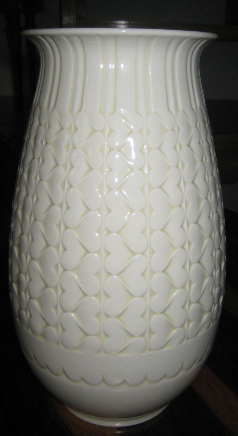 White glazed porcelain vase with incised geometric design. Dated 1934 on the base.