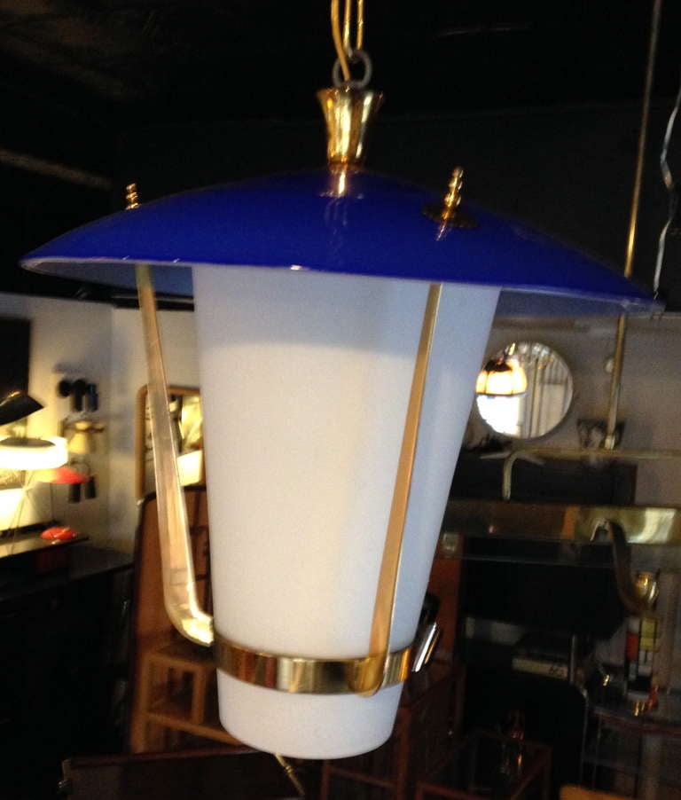 Cobolt blue and milk glass lantern-styled ceiling lamp with brass blade armature.