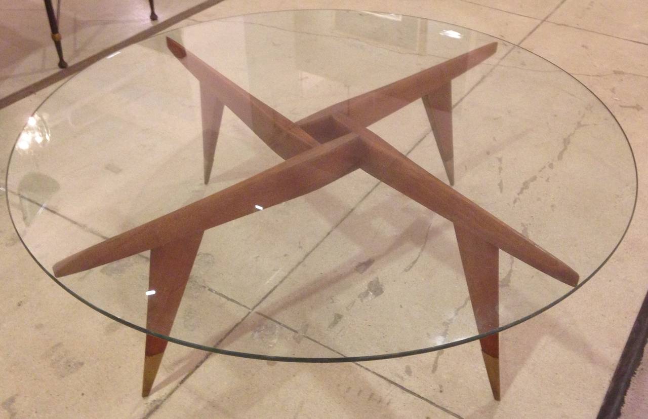Fantastic design for Singer & Son. Italian walnut with brass sabots and glass tabletop.