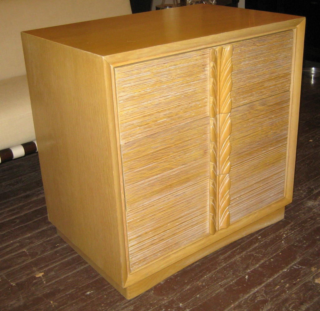 Decorative pair of oak chests with deeply combed and lightly cerused front drawers and carved acanthus leaf handles.