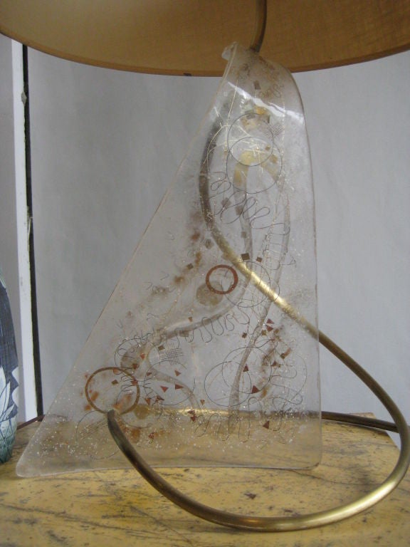 Extremely rare, hand-made table lamp by this Israeli-American artist and designer, Schatz created an abstract design from brass wire, which she arranged between two pieces of triangular acrylic. Applying high heat fused the pieces together and made