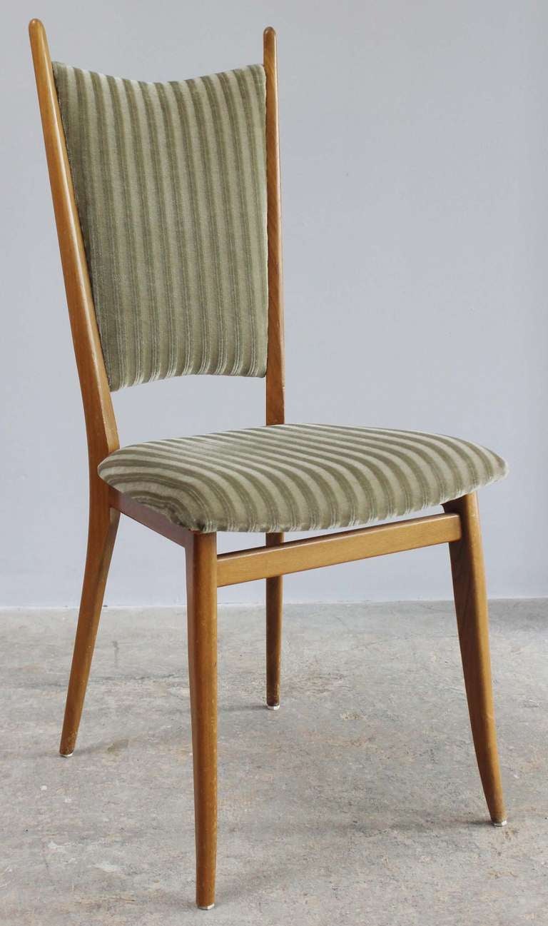 Pair modern blonde wood side or dining chairs in vintage upholstery.

Three available.