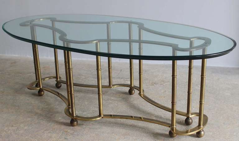 Mastercraft faux bamboo, patinaed brass coffee table, with oval, bevelled glass.