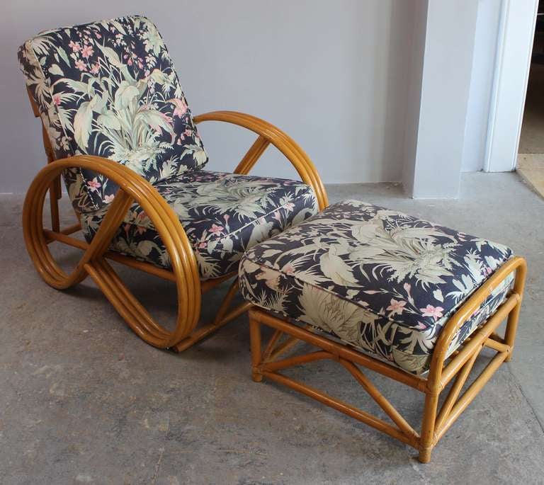 Paul Frankl style rattan reclining chair and ottoman, upholstered in vintage fabric.
Ottoman is 17" high x 26" long x 23" wide