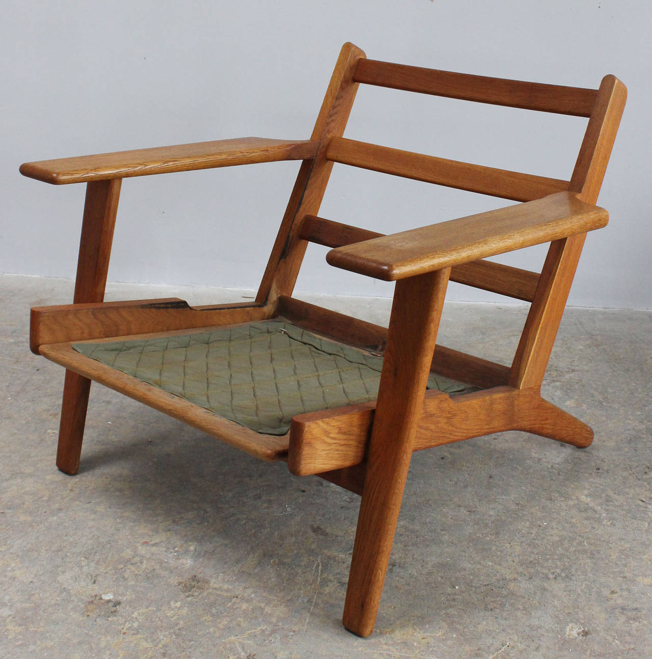 Pair of oak frame paddle armchairs with original cushions by Hans Wegner.